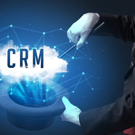 Magician using wand to pull the words "CRM" out of his hat